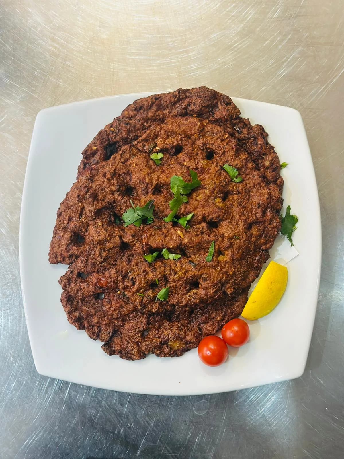 A chapli kebab straight off the tawa